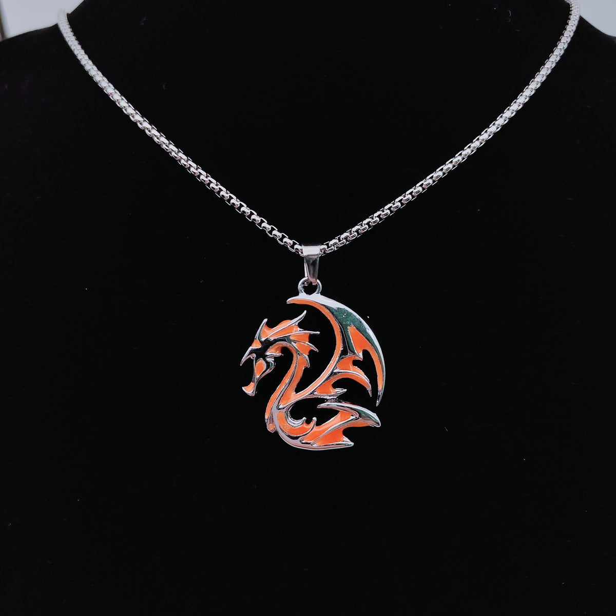 Flame orange tribal dragon pendant necklace on silver-tone chain