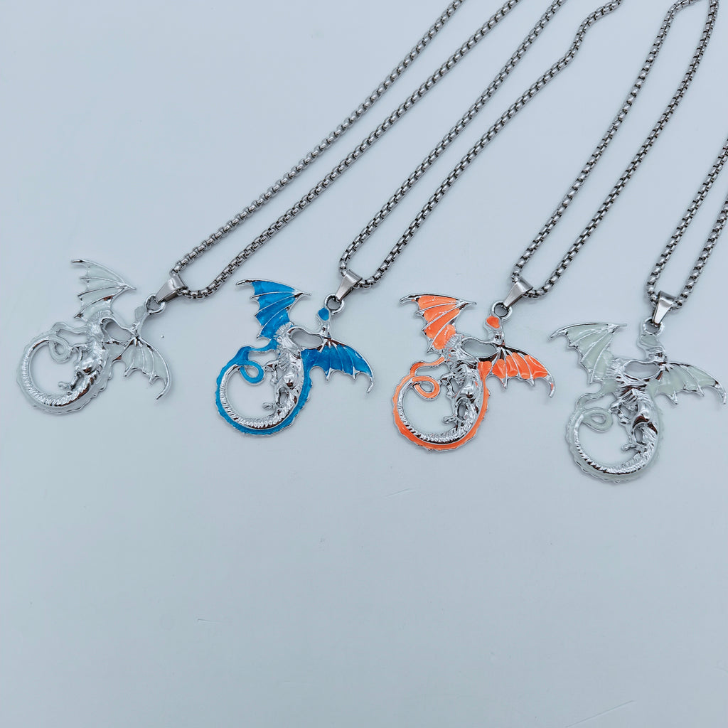 Four colour variations of the flying dragon pendant necklace