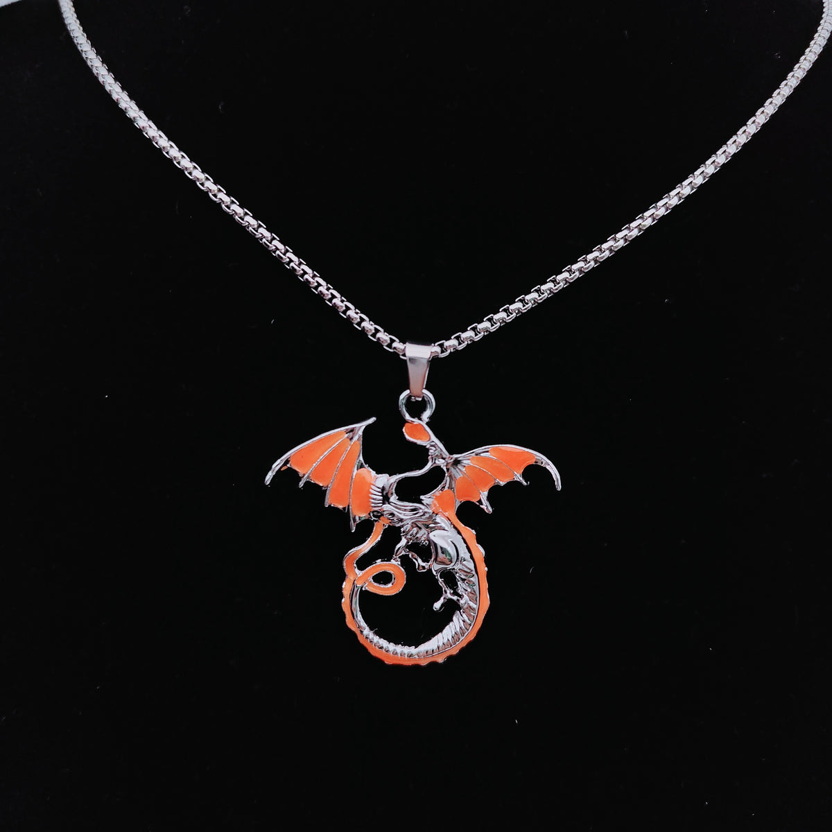 Flame orange flying dragon pendant on silver-tone chain