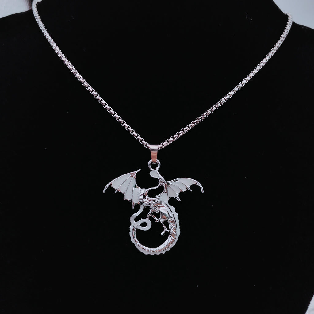 Light-coloured glow in the dark flying dragon necklace