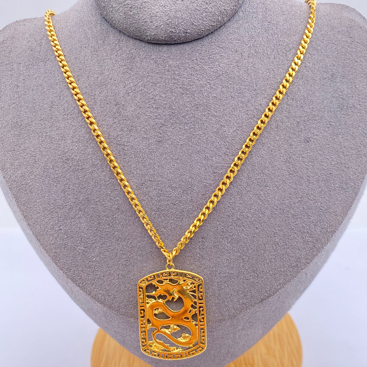 Gold-coloured Chinese dragon necklace with rectangular openwork pendant and matching chain
