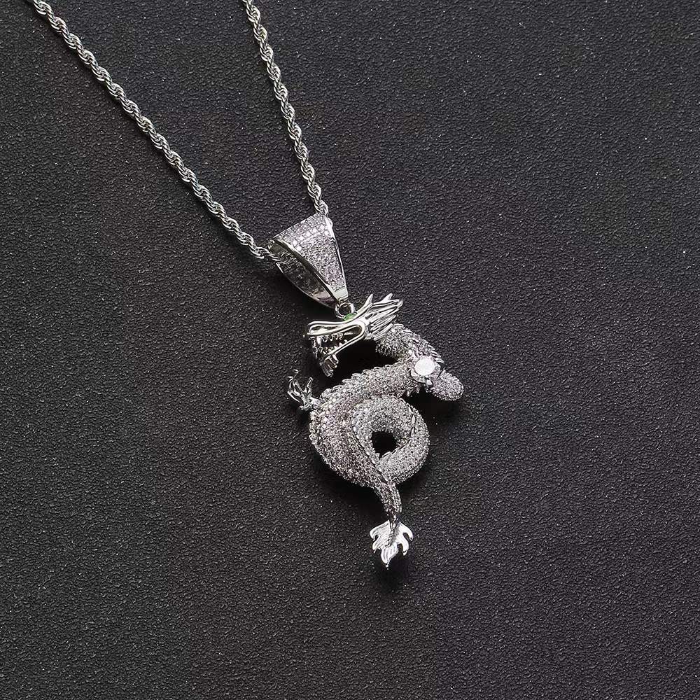 Silver-tone jewelled dragon serpent pendant with sparkling stones, coiled dragon design and matching chain.