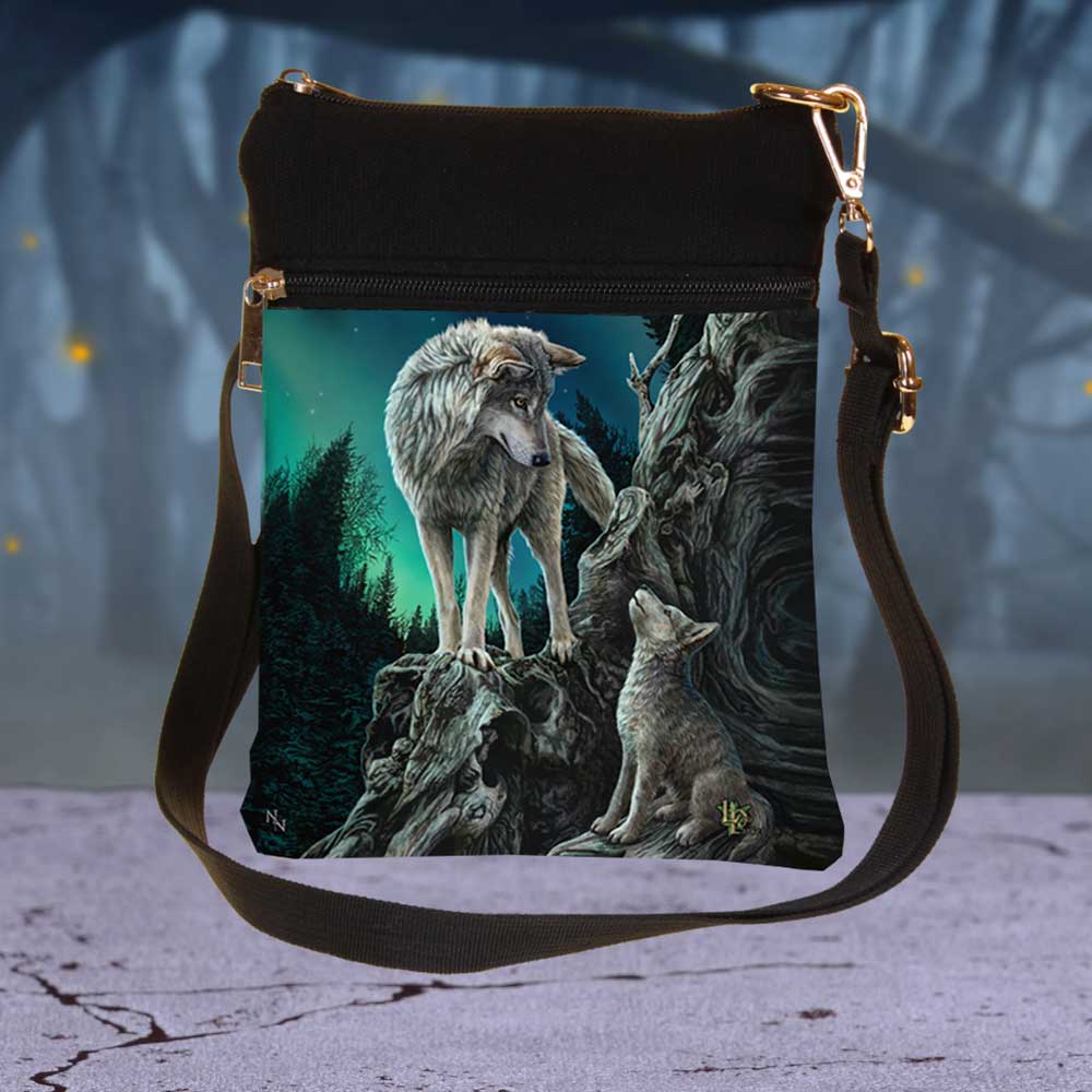 Lisa Parker Guidance wolf and pup shoulder bag displayed against a mystical forest backdrop
