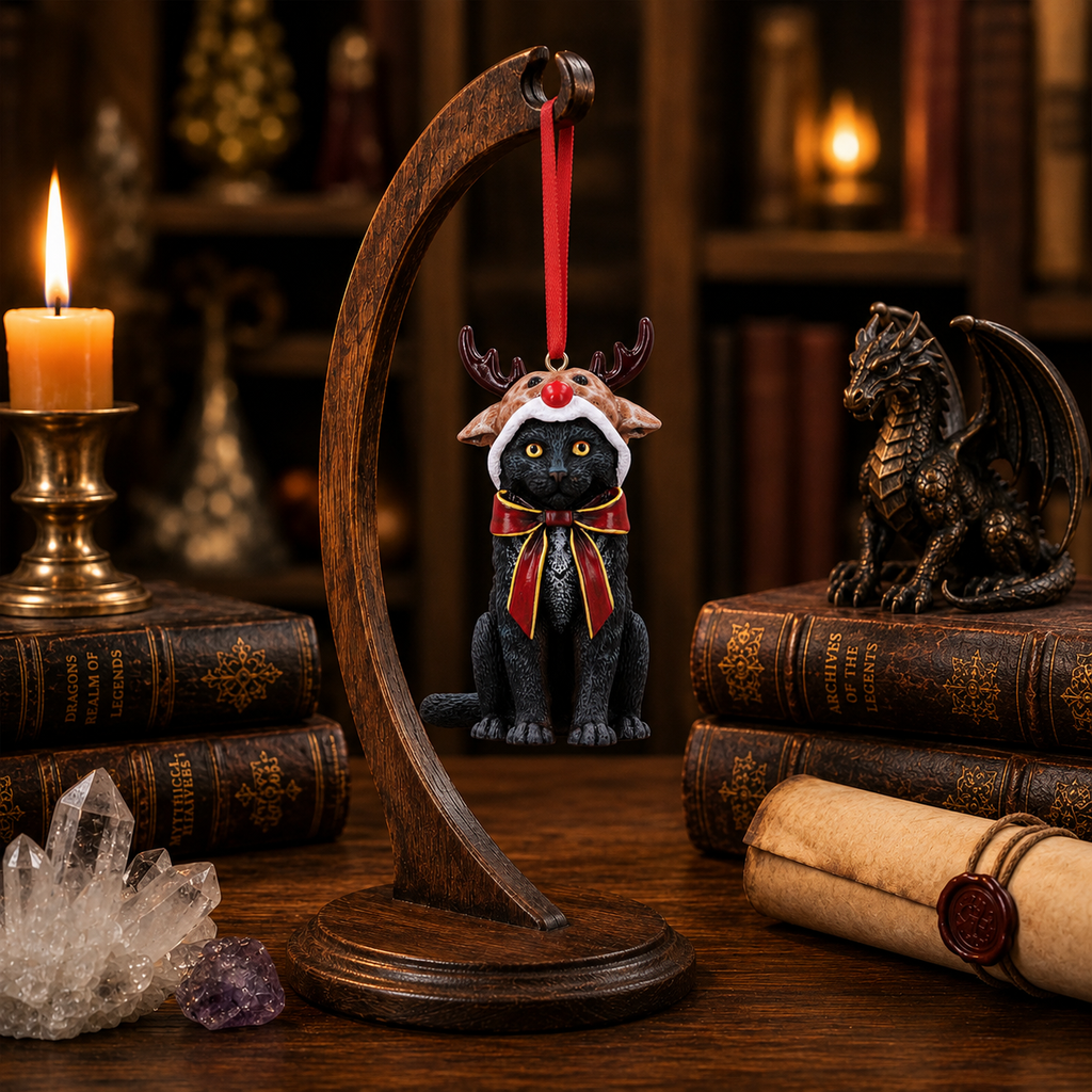 Lisa Parker black cat reindeer Christmas ornament displayed on a wooden stand in a candlelit fantasy collector's study.