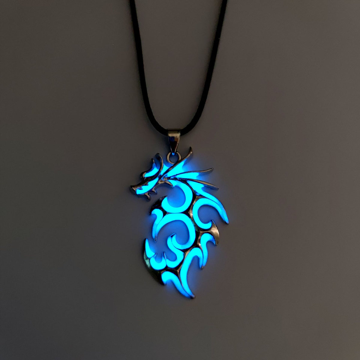 Blue tribal flame dragon necklace featuring intricate swirling dragon design