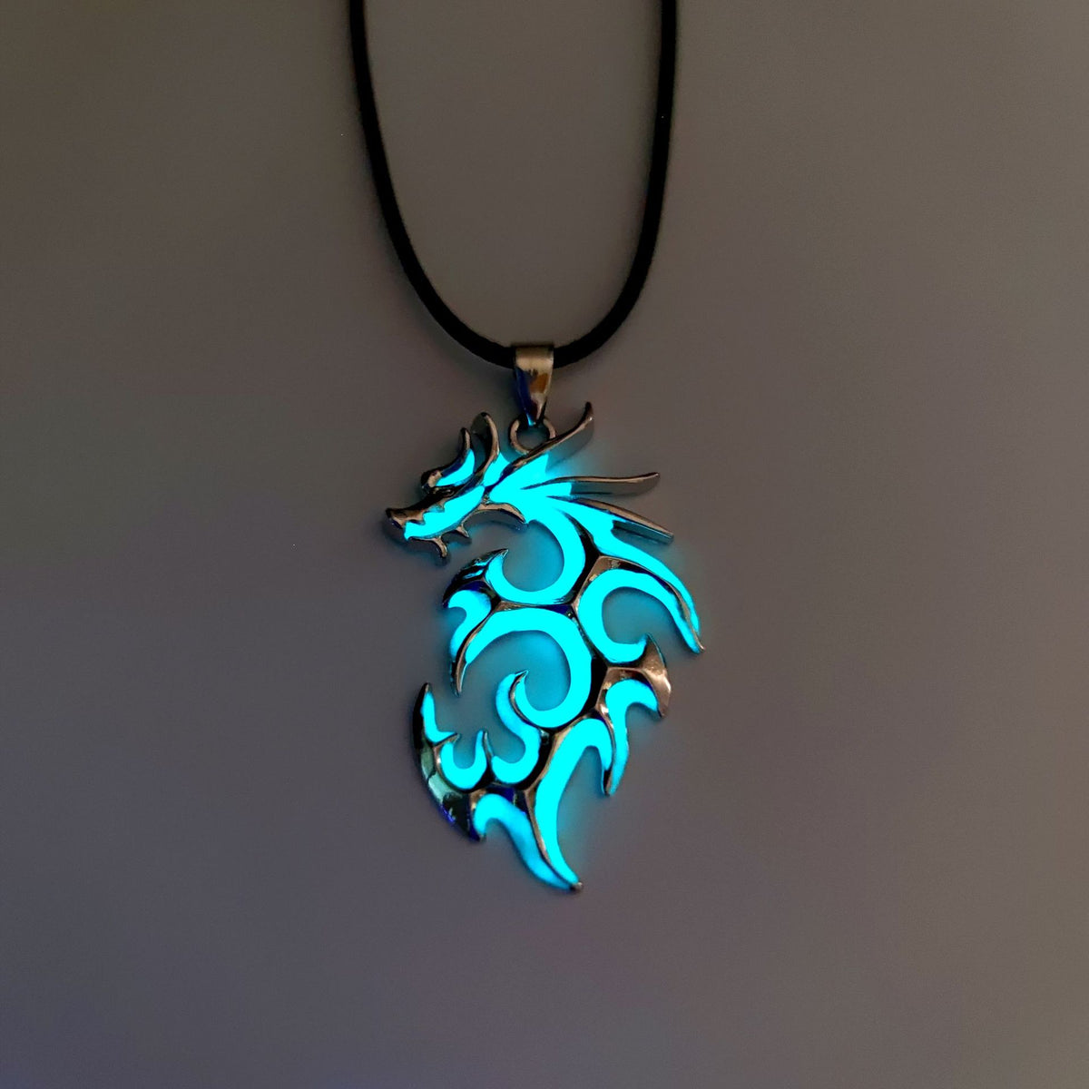 Light Blue tribal flame dragon necklace featuring intricate swirling dragon design
