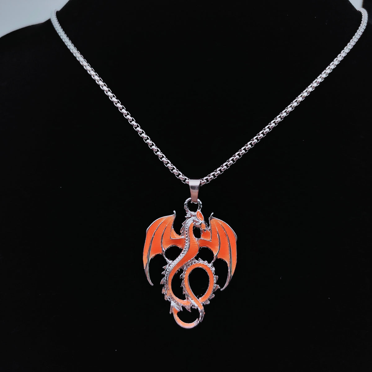 Flame orange Wyvern Dragon necklace with outstretched wings on silver-tone chain