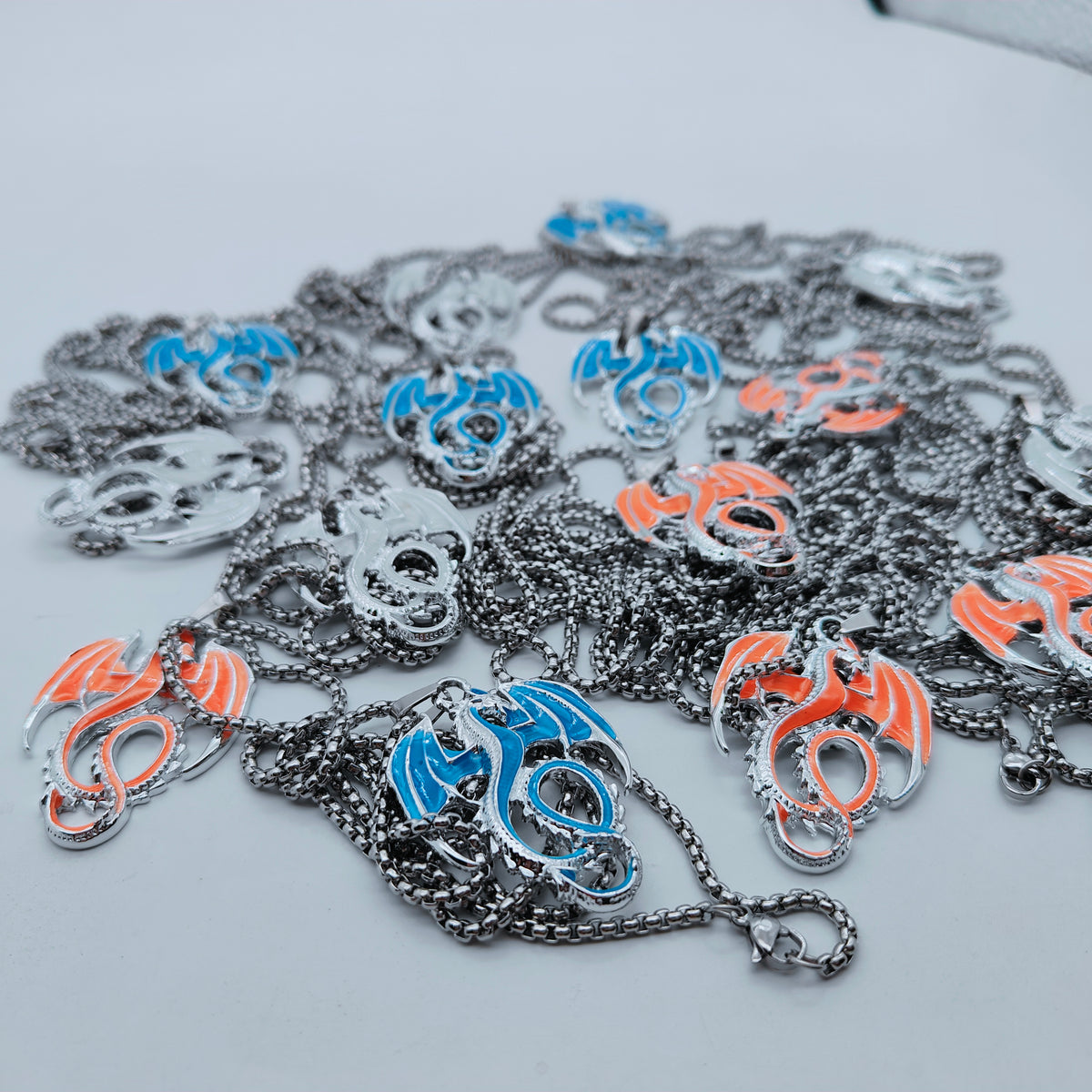 Assortment of glow in the dark Wyvern Dragon necklaces with matching chains
